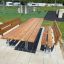 Bàn và ghế Table & Bench Steel Construction với khung thép và mặt gỗ cho khu vui chơi ngoài trời.