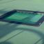 Square trampoline (150 cm) màu xanh lắp âm nền sân chơi trẻ em an toàn.