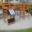 Khu vui chơi trẻ em bằng gỗ với cầu trượt và thang leo trên bề mặt Wetpour 45.