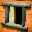 Cửa sổ bằng gỗ màu đen trên tường gỗ của Crooked house II.