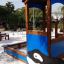 Villa with Orca single playhouse bằng gỗ màu xanh cho trẻ em vui chơi ngoài trời.